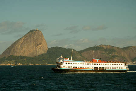 Ferry boat called 'Barca' in front of Sugarloaf Mountain, Rio De Janeiro, Brazilの写真素材