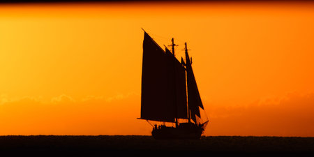 Silhouette of sailing ship in the Atlantic ocean, Key West, Monroe County, Florida, USAの写真素材