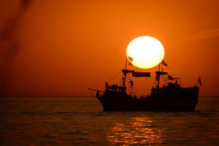Silhouette of sailing ship in the Atlantic ocean, Key West, Monroe County, Florida, USAの写真素材