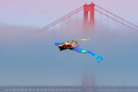 Flying Kyte with the Golden Gate on the backgroundの写真素材