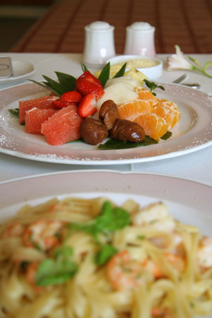 Close-up of fruit salad dessert with big shrimp pastaの写真素材