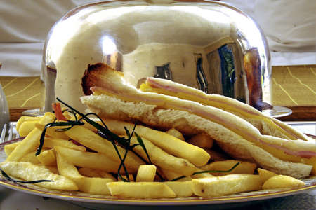 Close-up of a ham and cheese sandwich with French friesの写真素材