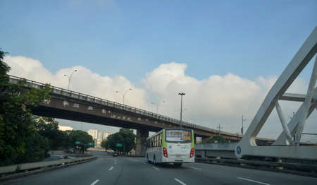 Rio de Janeiro, Brazil - may 25, 2018:  Urban passenger bus passing over the viaduct on day of little traffic in the cityのeditorial素材