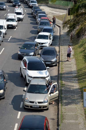 Rio de Janeiro, Brazil - may 25, 2018:  Because of the truck drivers' strike the city faces lack of fuel. The drivers queue to fill the tank at the gas stationsのeditorial素材