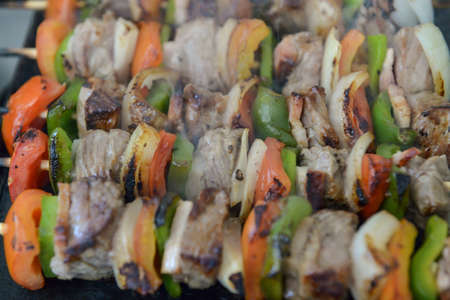 mixed barbecue skewer of raw meat and vegetablesの写真素材