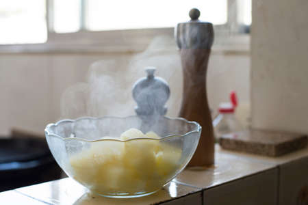 Hot potatoes pot, coming out smoke.の写真素材