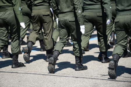 Military marching in a street. Legs and shoes in line.のeditorial素材