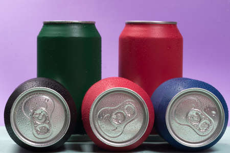 Colorful aluminium cans with a carbonated drink.の写真素材