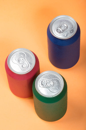 Colorful aluminium cans with a carbonated drink.