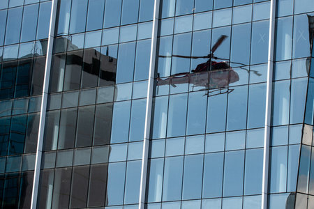 Rio de Janeiro, Brazil - september 07, 2018: reflection of a helicopter on a modern glass buildingのeditorial素材