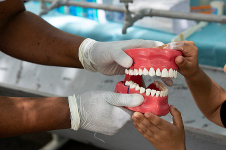 Rio de Janeiro, Brazil - november 22, 2018: Health professional teaches how to floss with a dental...