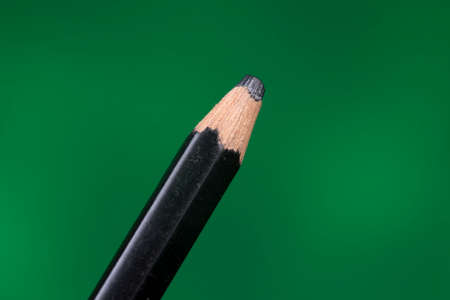 tip detail of color pencils on a green background.の写真素材
