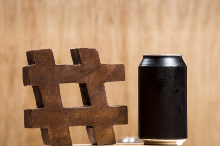 can of black soda with the hashtag symbol.