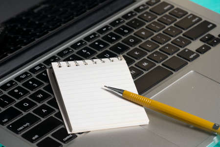 A notebook, paper note and a mechanic penの写真素材