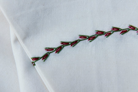 handmade dish cloth on a dark wood background