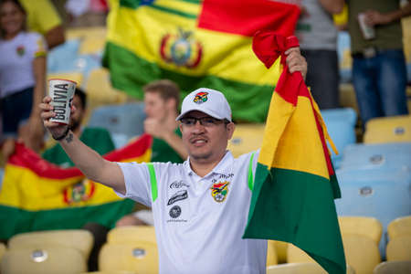 RIO DE JANEIRO, BRAZIL - June 18, 2019: Soccer fans celebrating at the 2019 America Cup game between Bolivia and Peru at Maracana Stadium.のeditorial素材