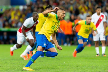Rio, Brazil - July 7, 2019: Richarlison of Brazil kicks the ball during the 2019 America Cup finals game between Brazil and Peru at Maracana Stadium.のeditorial素材
