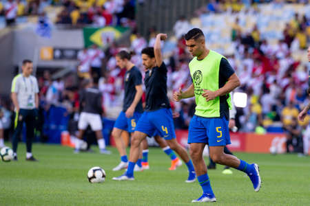 Foto de Rio, Brazil - July 7, 2019: Casemiro of Brazil entering the field before the CONMEBOL 2019 America Cup finals at Maracana Stadium. - Imagen libre de derechos