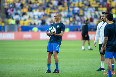 Rio, Brazil - July 7, 2019: Joao Miranda of Brazil entering the field before the CONMEBOL 2019 America Cup finals at Maracana Stadium.のeditorial素材