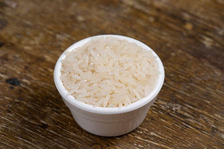 some jars with beans grains on rustic wooden tableの写真素材