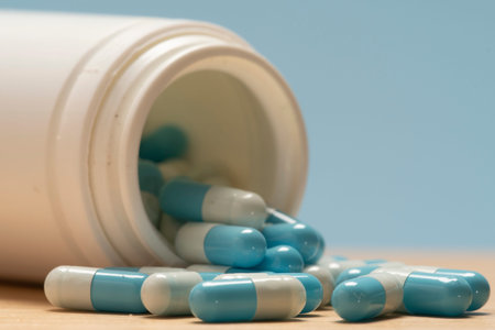 Blue and white Pills Spilling from the Bottle