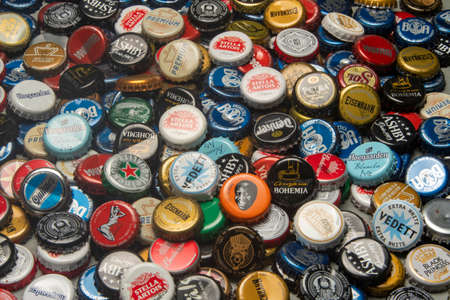Rio de Janeiro, Brazil - december 27, 2019: stack of beer bottle caps with various brewery brands around of worldのeditorial素材