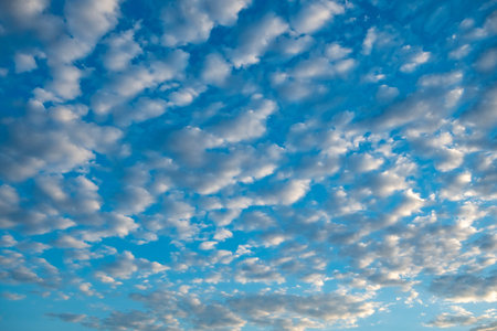 Blue sky and clouds in a pattern.