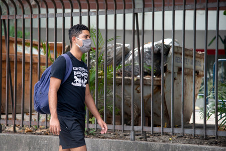 Rio, Brazil - may 06, 2020: People on the street wearing a mask to protect themselves from the coronavirus (covid-19). In the city the use is mandatoryのeditorial素材