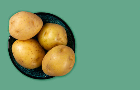 pot of raw potato seen from above. text spaceの写真素材