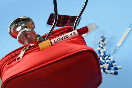 first aid kit with stethoscope and medicine blisterの写真素材