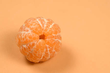 peeled tangerine isolated in a backgroundの写真素材