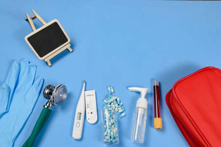 Medical equipment for the care of Covid-19 virus infection - stethoscope, thermometer, disposable gloves, coronavirus test and alcoholの写真素材