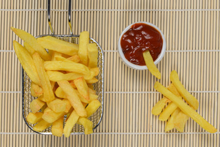 portion of potato chips in a metal basketの写真素材