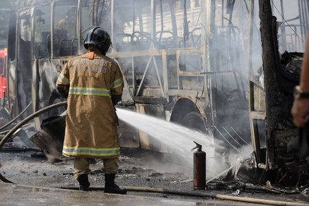 Rio, Brazil - september 28, 2020: fire brigade fighting a fire on bus at city street