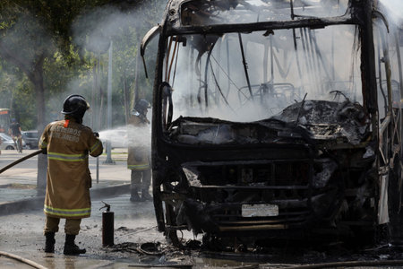 Rio, Brazil - september 28, 2020: fire brigade fighting a fire on bus at city street