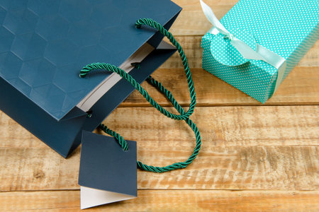 colorful gift packaging on rustic boards on top viewの写真素材