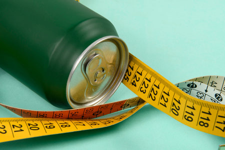 Green aluminum drink can with colorful measuring tape symbolizing person wanting to lose weight G