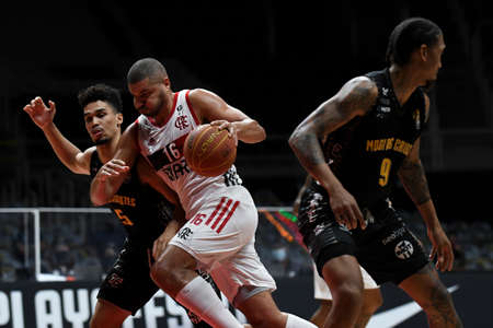 Rio, Brazil - April 30, 2021: Olivinha of Flamengo battles with Casiano of Mogi during the Mens New Brazilian Basketball (NBB) game between Flamengo and Mogi at Maracazinho Stadiumのeditorial素材