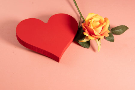 Heart shape with a rose on the side symbolizing love. ..