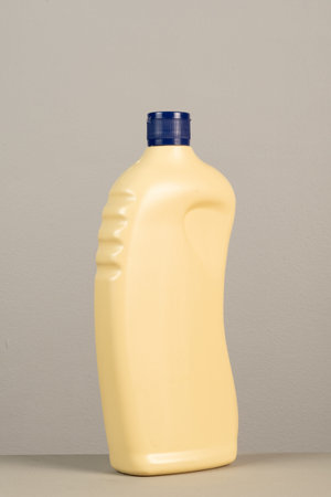 cleaning product plastic packaging on neutral gray background