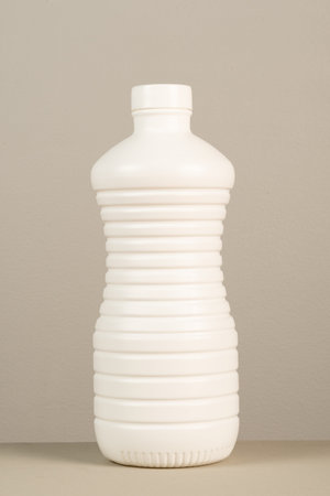cleaning product plastic packaging on neutral gray background
