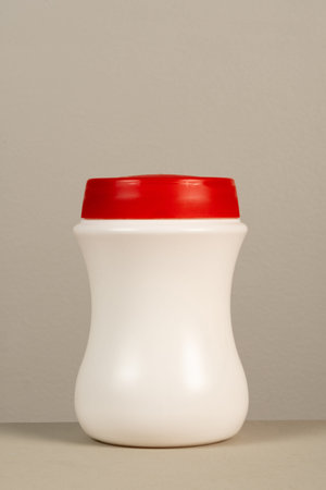 cleaning product plastic packaging on neutral gray background