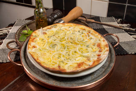 Brazilian style pizza with mozzarella, cheese, onion, top viewの写真素材