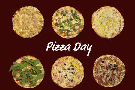 different flavors of pizza with the phrase "pizza day"の写真素材