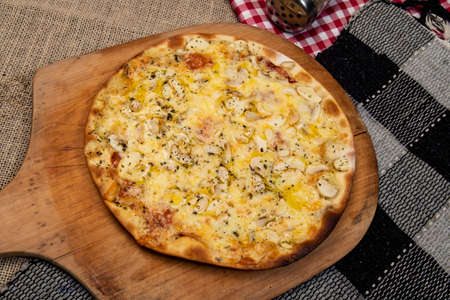 Brazilian mushroom, cheese and oregano pizza, top viewの写真素材