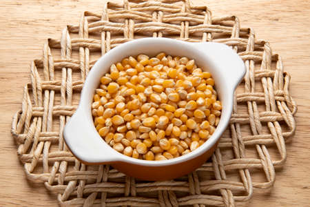 jar with grain - raw ingredient for preparing dishes - popcornの写真素材