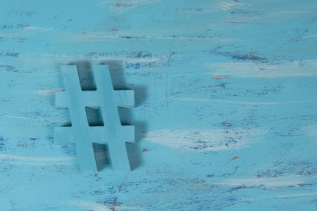 blue hashtag symbol on patina background in same color with space for text.の写真素材