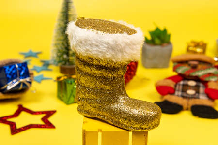 Ornament Santa Claus boot on yellow background with christmas elements.の写真素材
