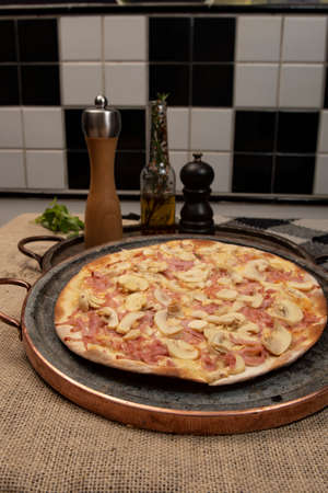 Brazilian mushroom, cheese and ham pizza, top viewの写真素材
