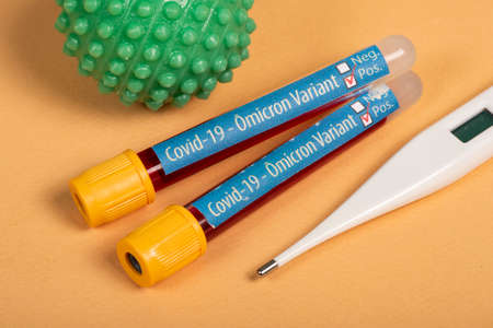 variant of covid-19 Omicron, written on blood collection tube, with various medical elements aroundの写真素材